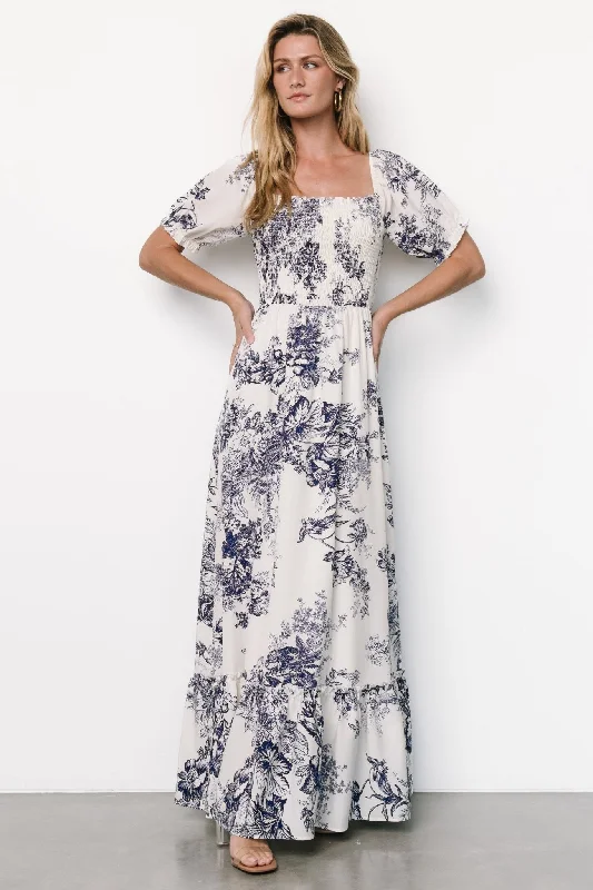 Calming Blue Maxi Dresses for a Soothing LookCapri Smocked Maxi Dress | Ivory + Blue Floral