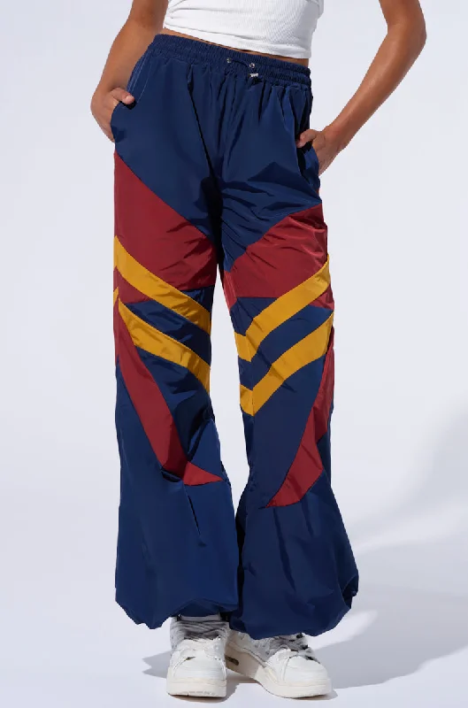 Recycled material pants for women in an eco - friendly optionBORN TO RUN WINDBREAKER JOGGERS Recycled material pants for women in an eco - friendly optionBORN TO RUN WINDBREAKER JOGGERS