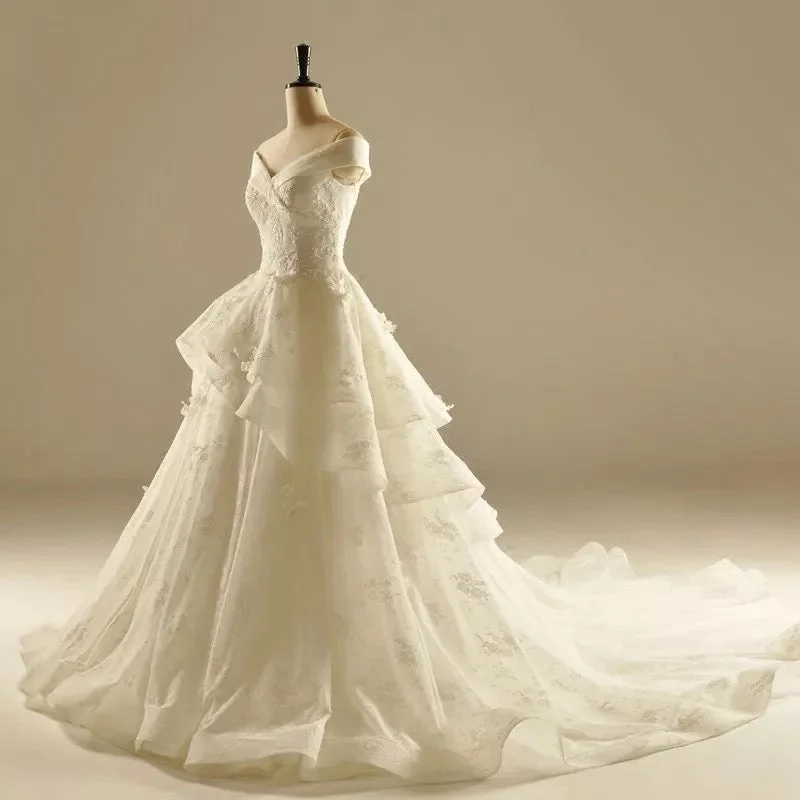 Maxi - length wedding dress for a grand lookIvory Lace A-line V Neck Off The Shoulder Wedding Dresses Princess