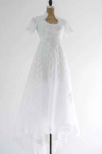 French - style wedding dress with lace detailsQueen Anne Neckline Short Sleeve A-Line Lace Dress With Beadings