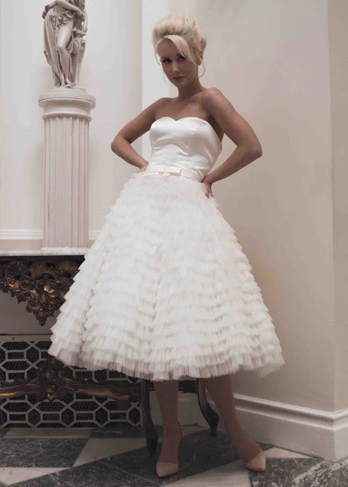 Scuba - fabric wedding dress for a modern fitRetro Strapless Tea Length Wedding Dress with Ruffled Skirt Scuba - fabric wedding dress for a modern fitRetro Strapless Tea Length Wedding Dress with Ruffled Skirt