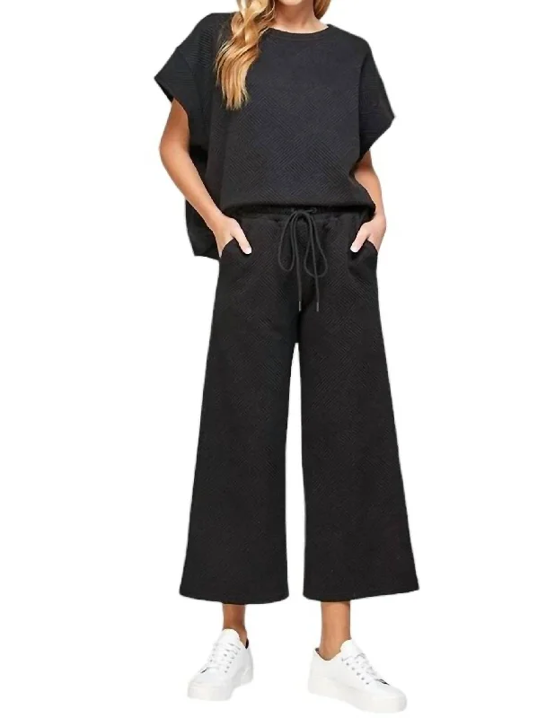 Embroidered linen pants for women in a natural styleTextured Short Sleeve And Cropped Flare Pant Set In Black